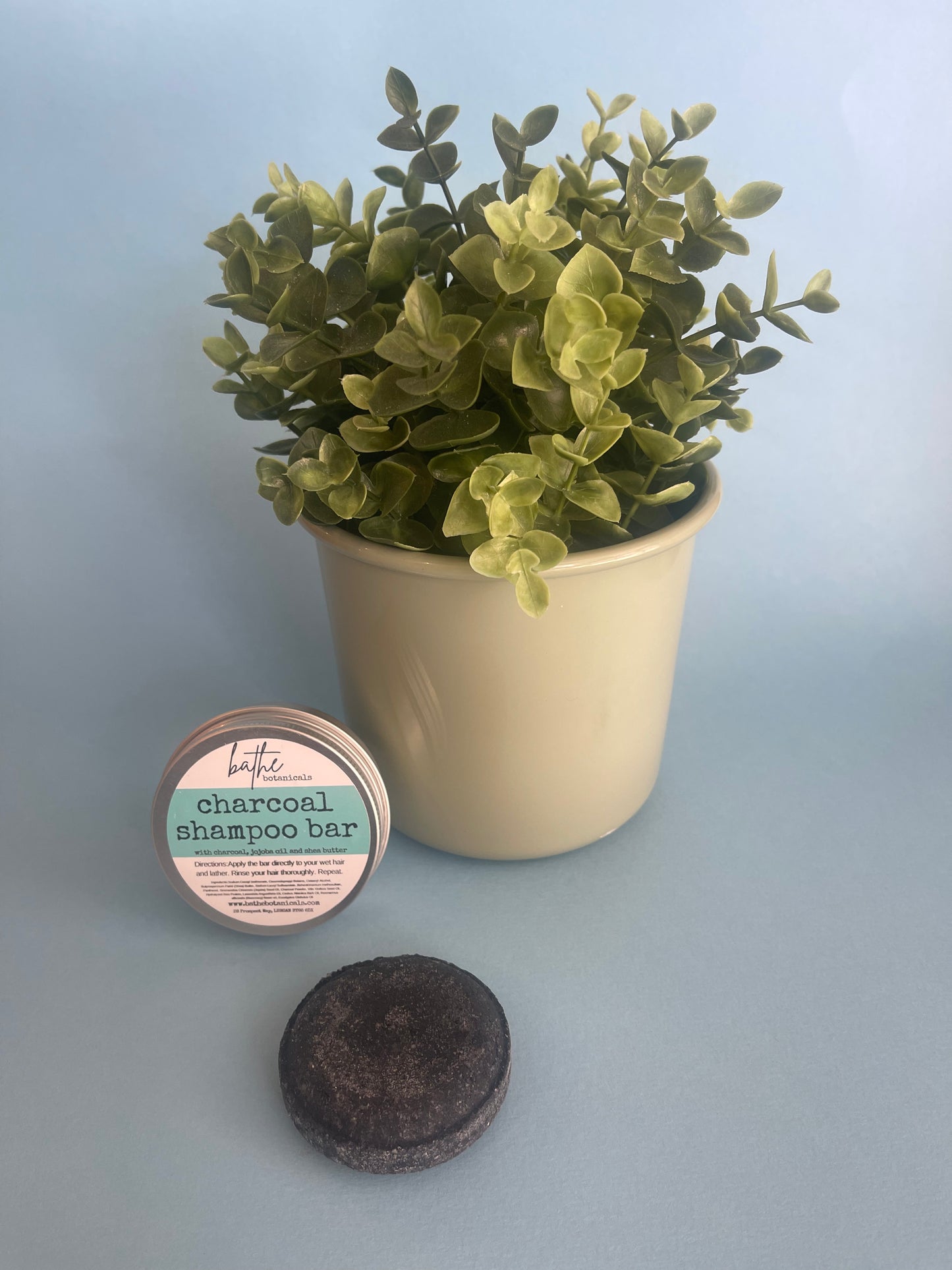 Charcoal detox shampoo bar in aluminium tin