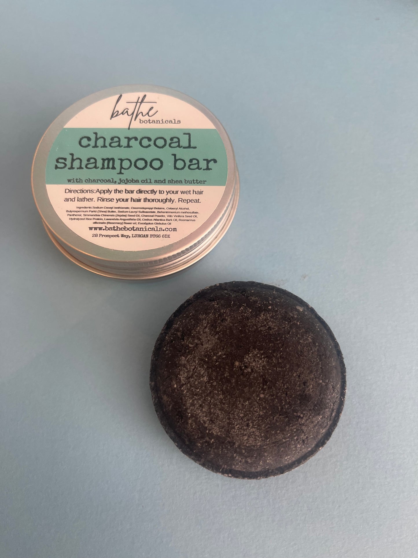 Charcoal detox shampoo bar in aluminium tin